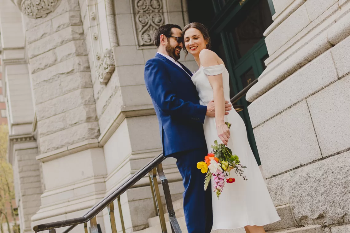 Couple in front of civic building after city hall wedding